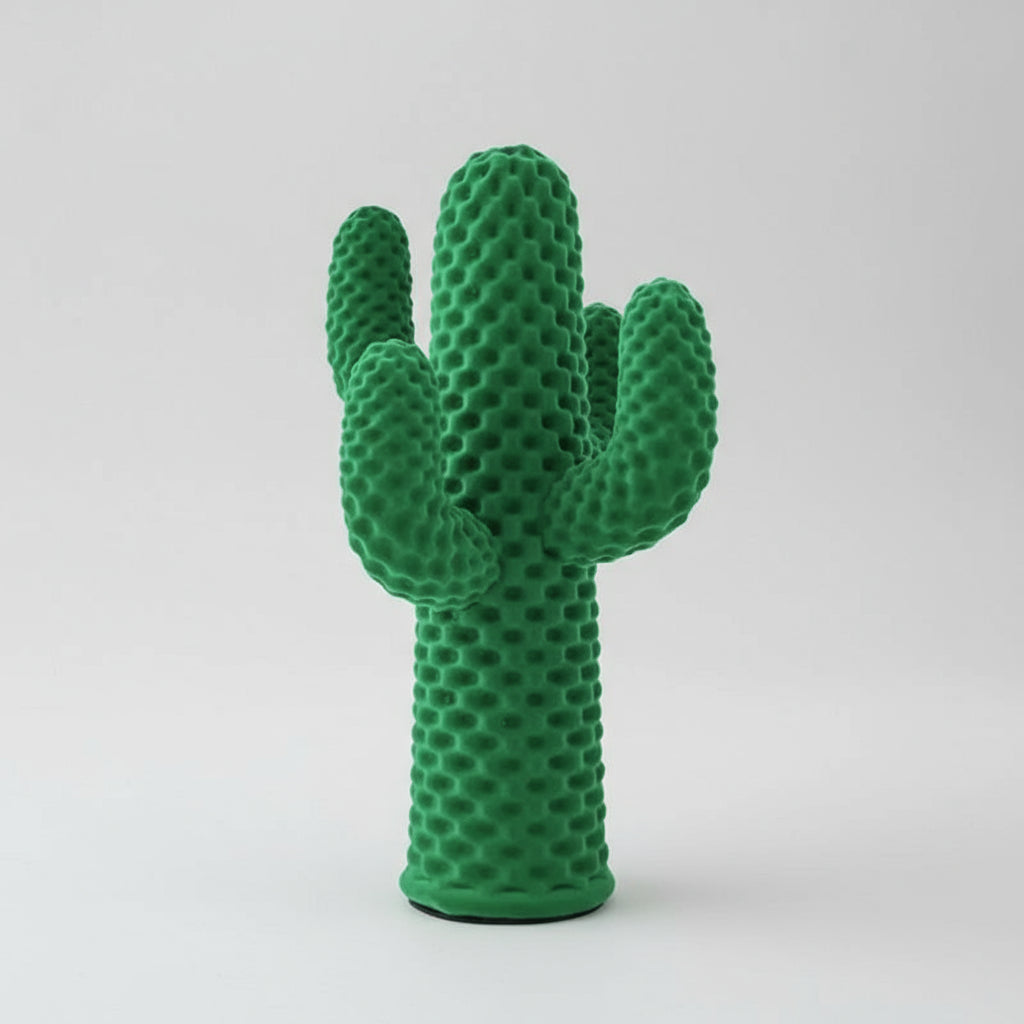 Green cactus-shaped decor item on a white background
