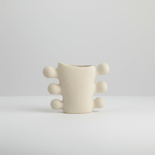 Beige textured vase with dimensions labeled on a white background