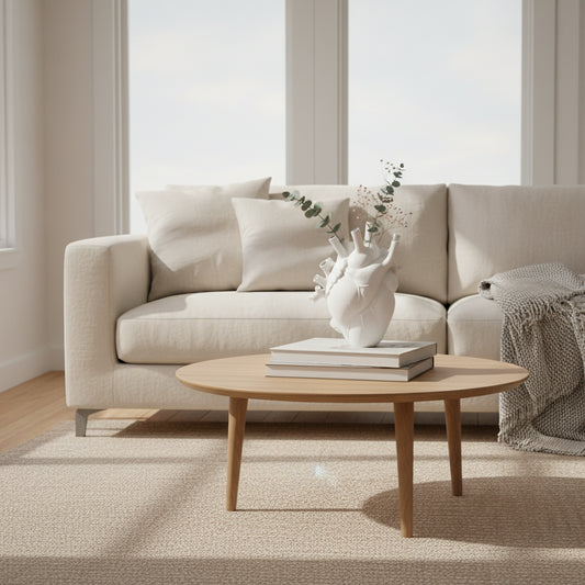 White anatomical heart-shaped vase on a modern living room