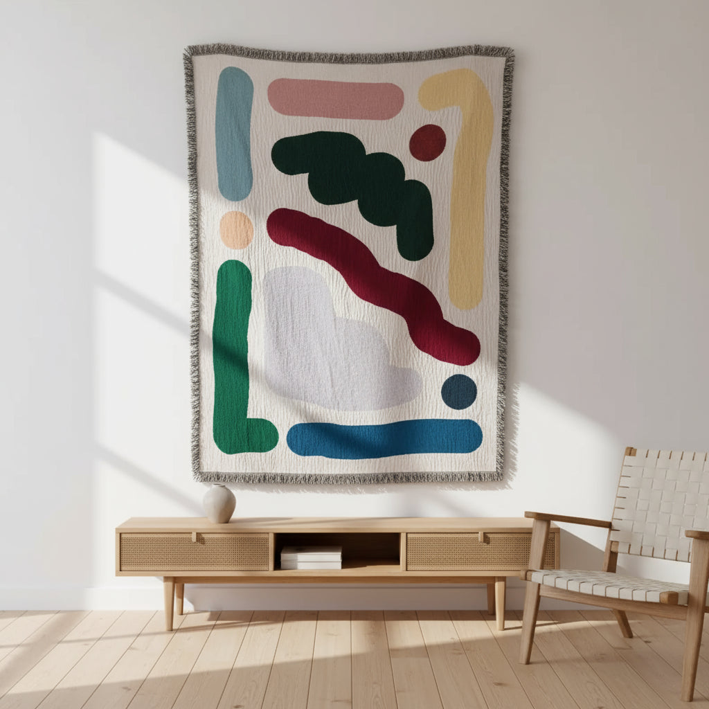 Colorful abstract-patterned throw blanket on a white surface