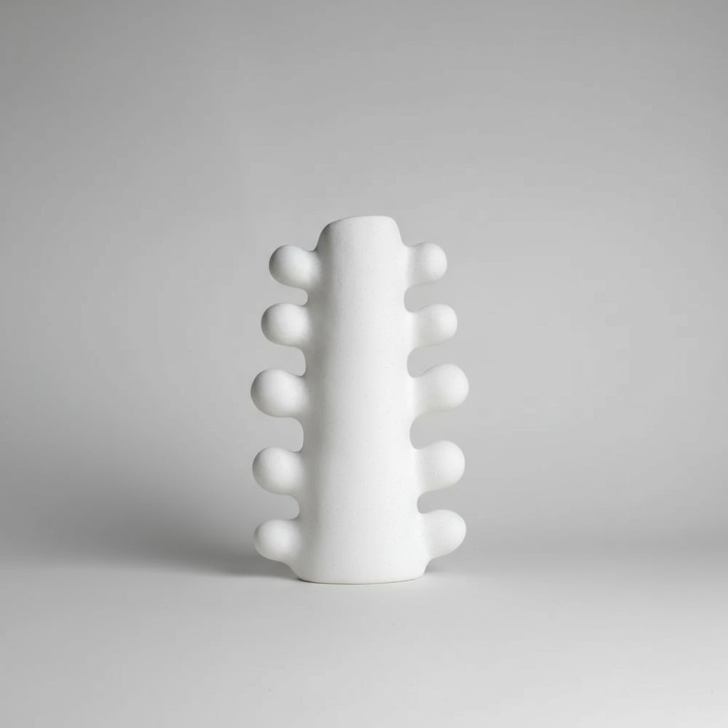 White textured vase on a beige background