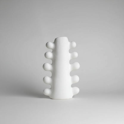 White textured vase on a beige background