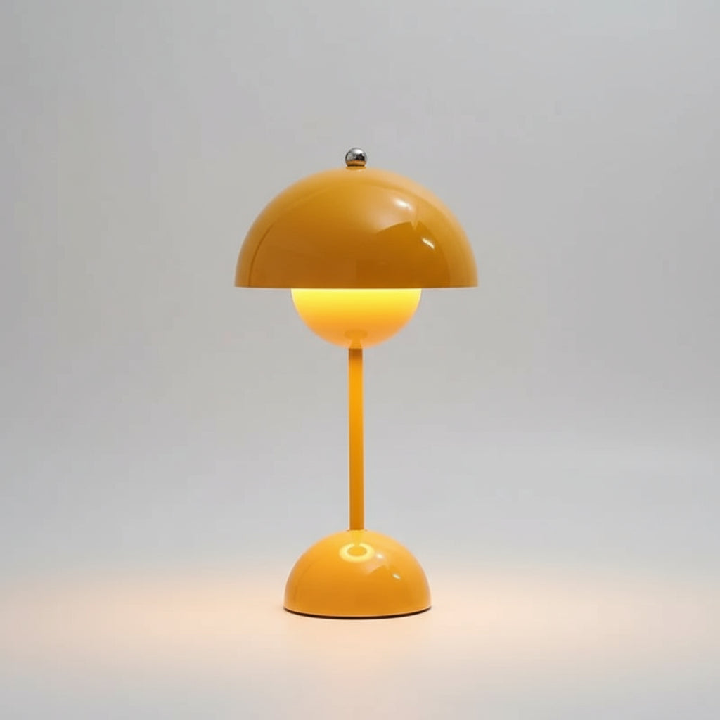Yellow table lamp on a surface with a blurred background
