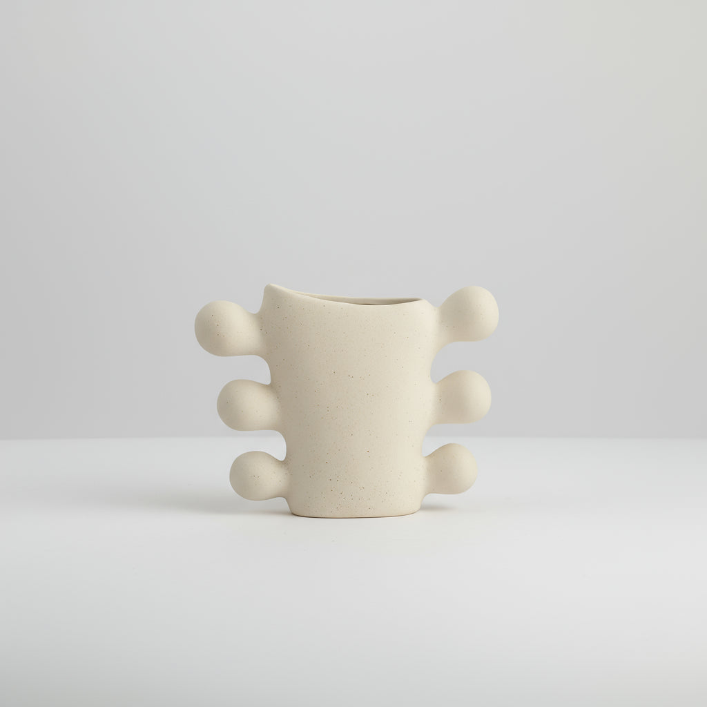 Beige textured vase with dimensions labeled on a white background