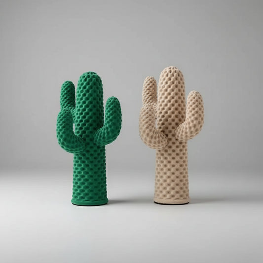 Two textured cactus sculptures, one green and one beige, on a neutral background.