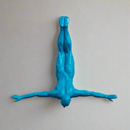 Blue wall sculpture of a person on a plain background