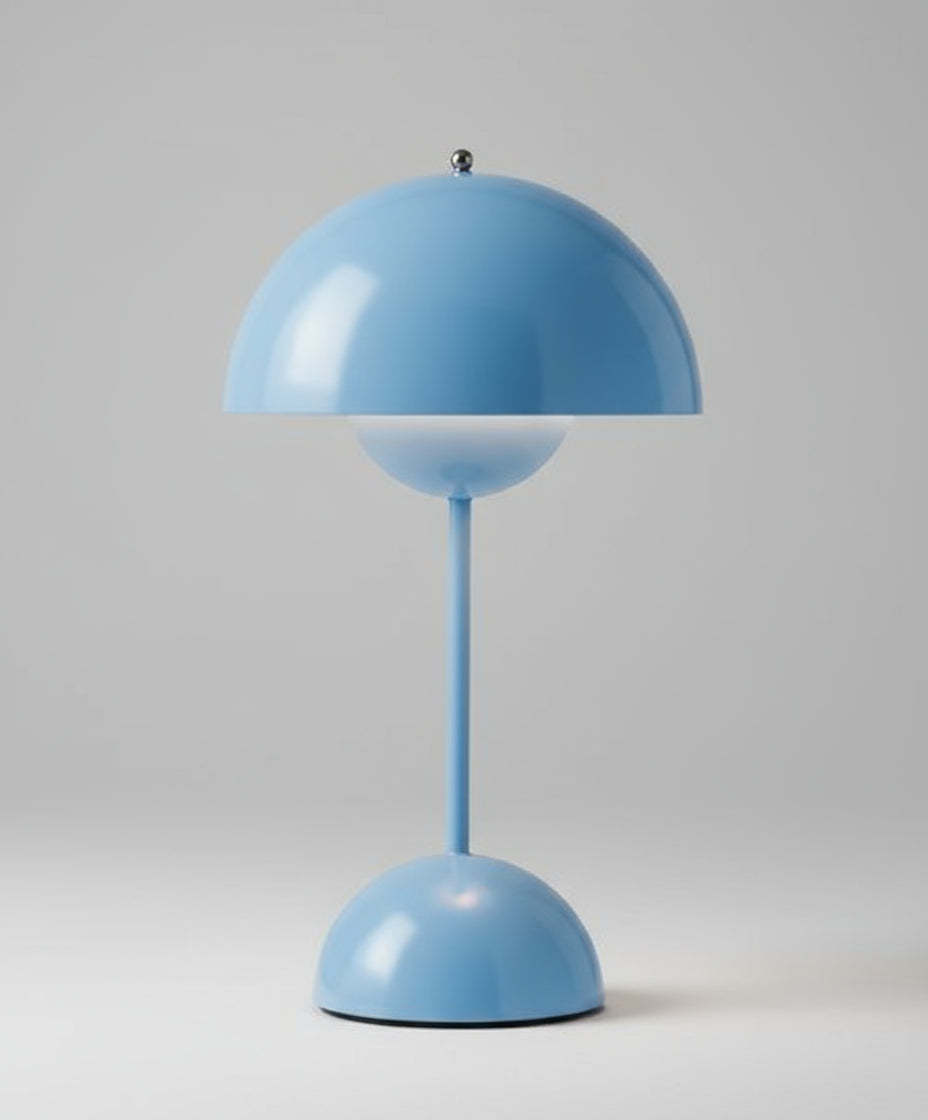 Blue table lamp against a white background