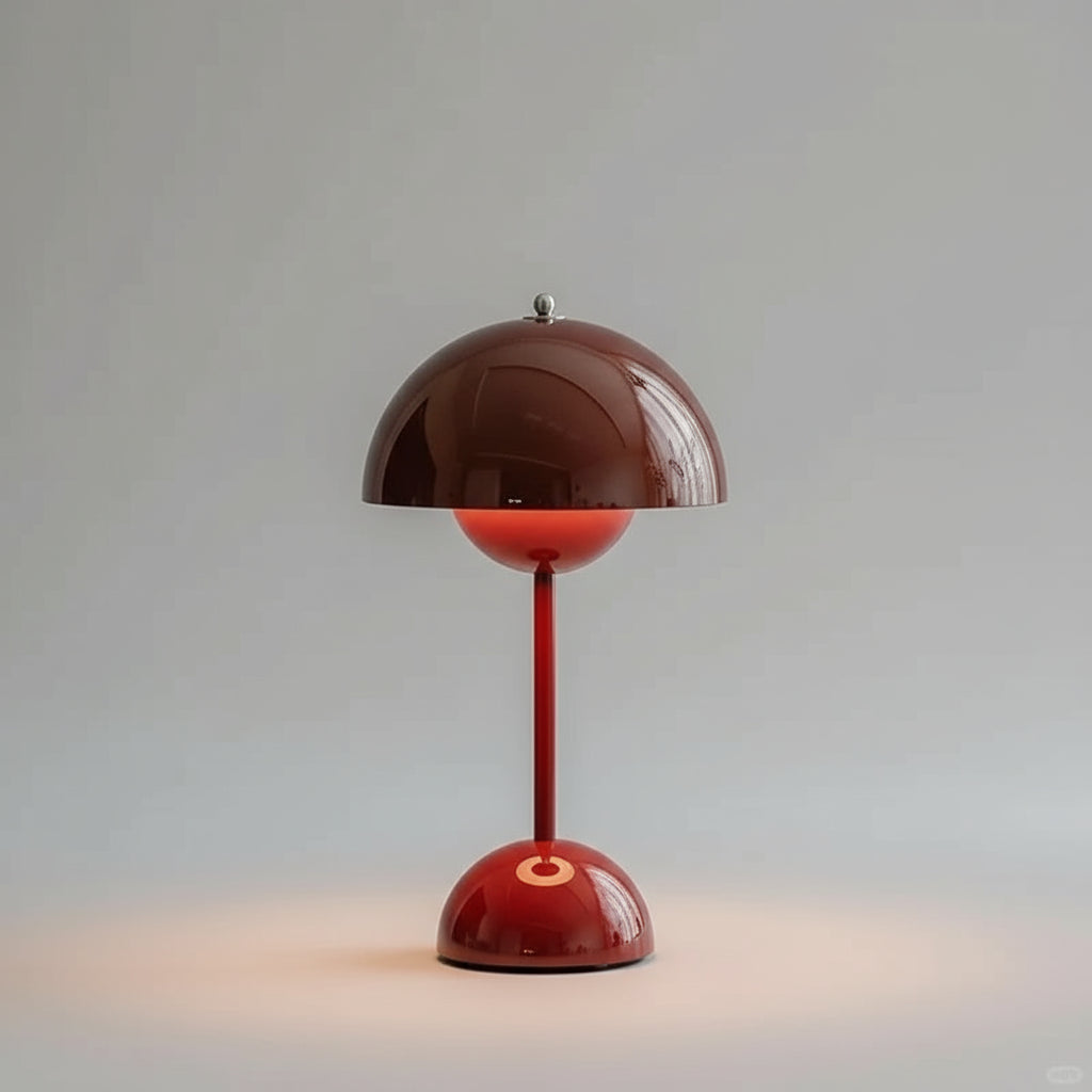 Red table lamp with a brown shade on a gray background