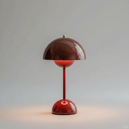 Red table lamp with a brown shade on a gray background
