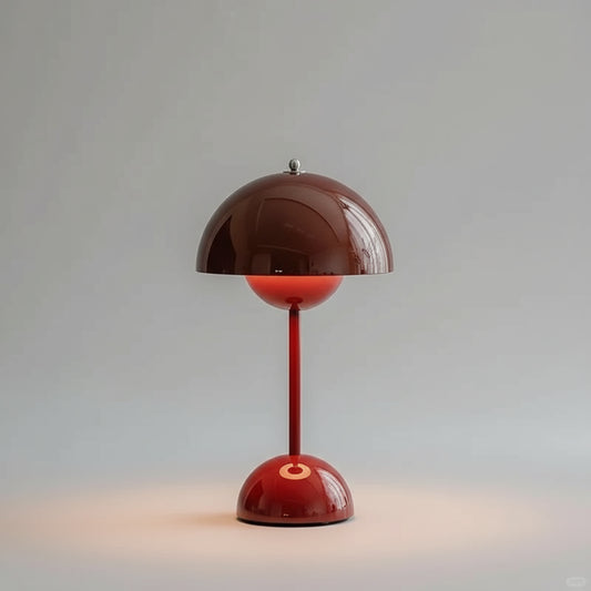 Red table lamp with a brown shade on a gray background