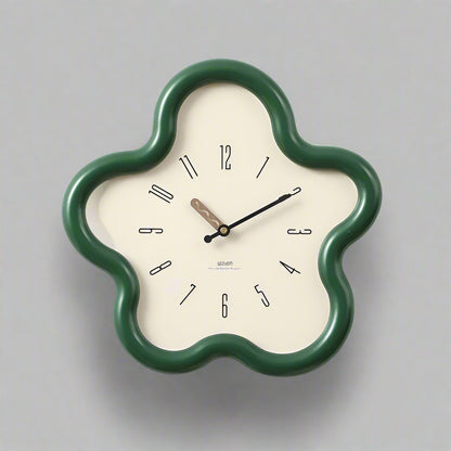 Floral-shaped wall clock with green frame on a white background