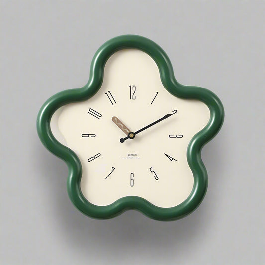 Floral-shaped wall clock with green frame on a white background