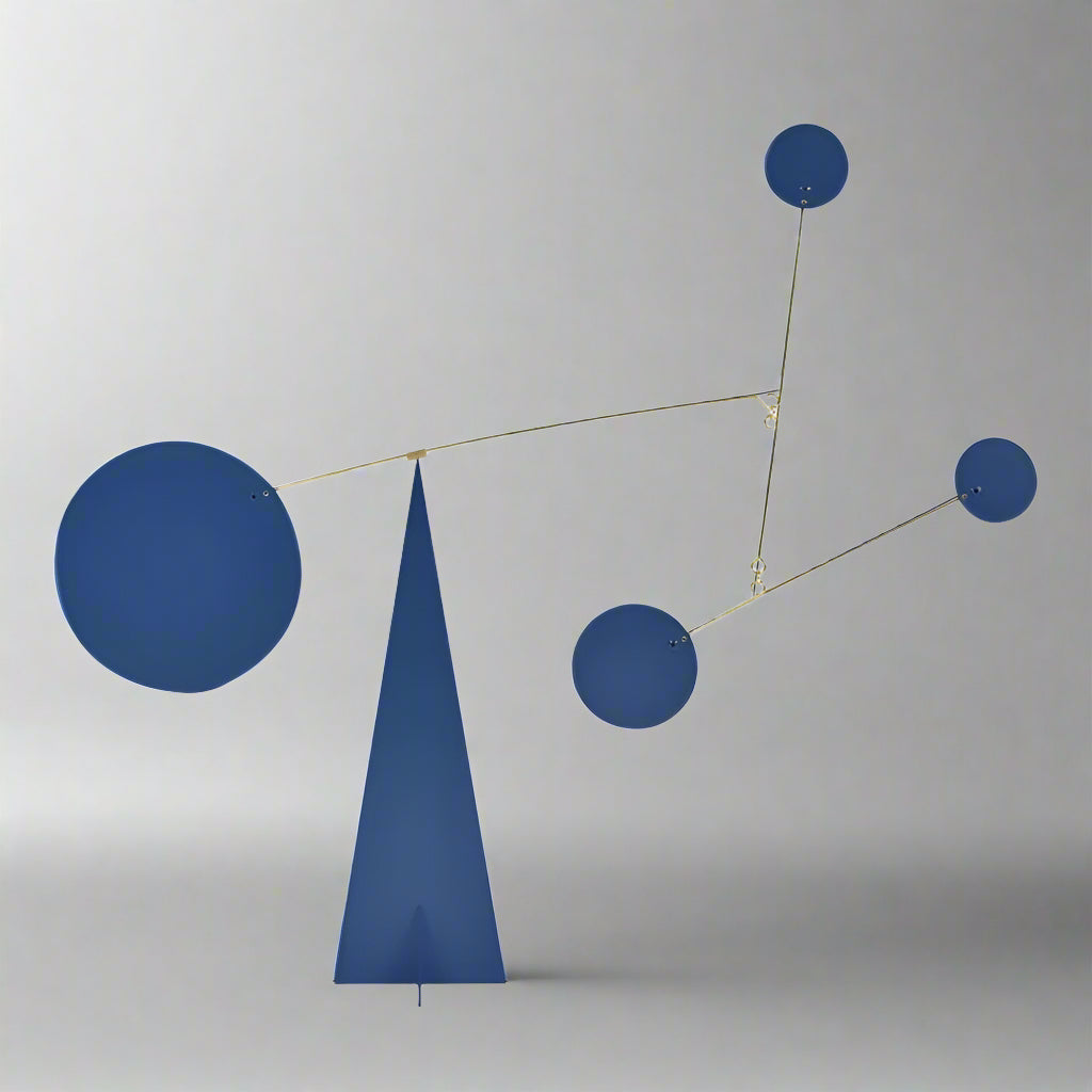 Abstract sculpture with blue geometric shapes on a white background