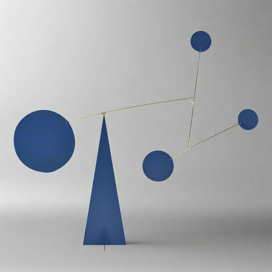 Abstract sculpture with blue geometric shapes on a white background