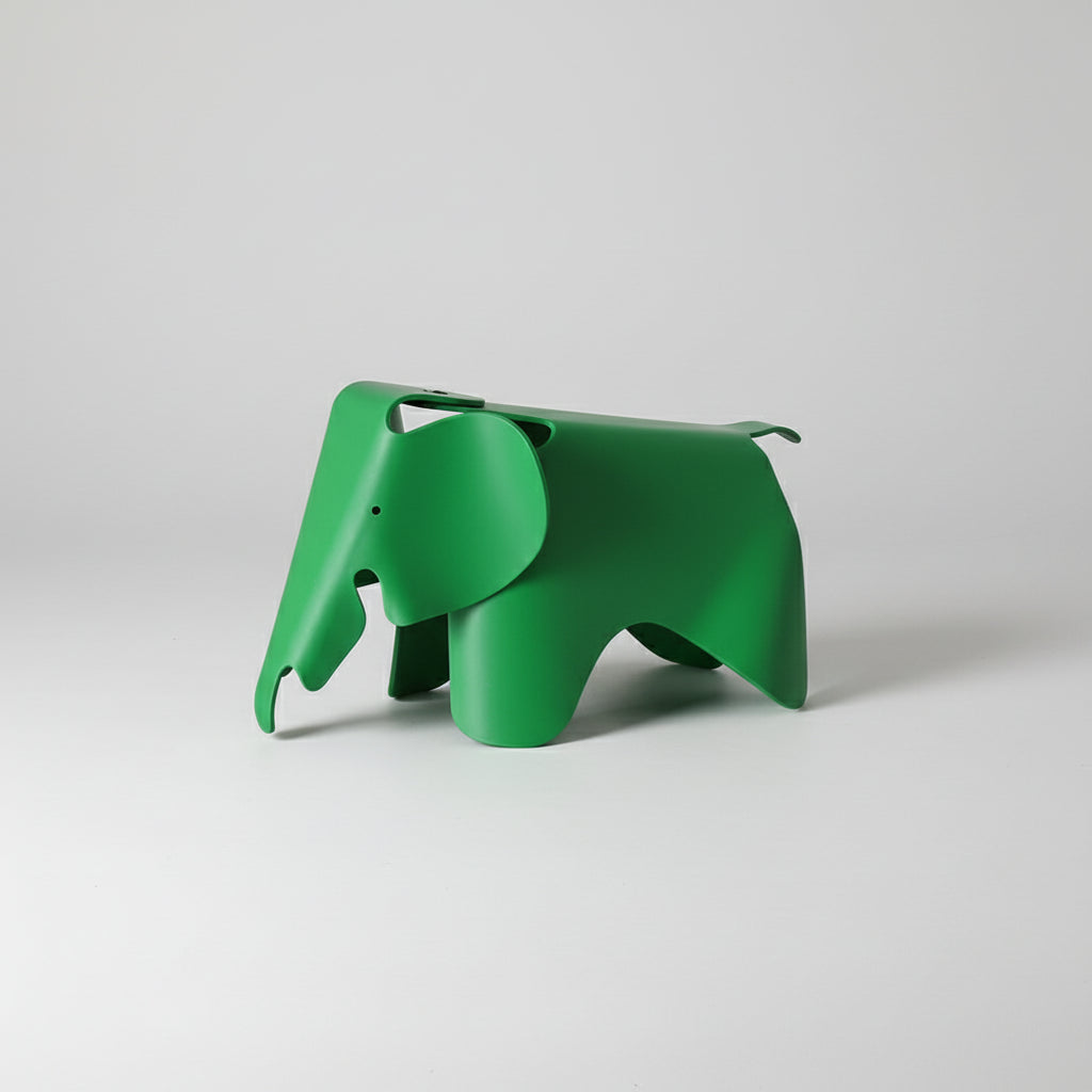 Green elephant-shaped decor item on a white background
