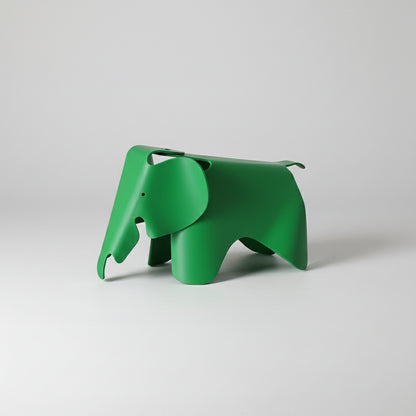 Green elephant-shaped decor item on a white background