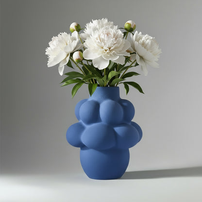 Blue textured vase on a light gray background