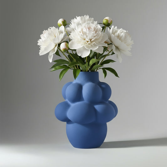 Blue textured vase on a light gray background