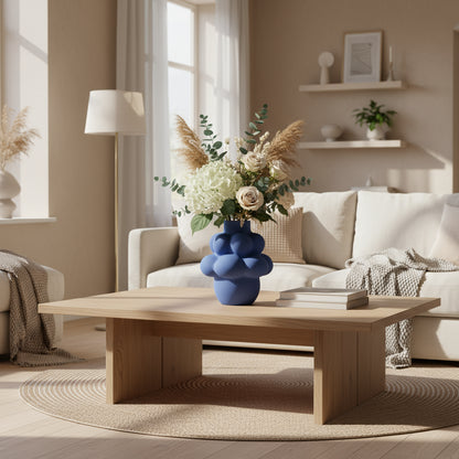 Blue textured vase on a light gray background