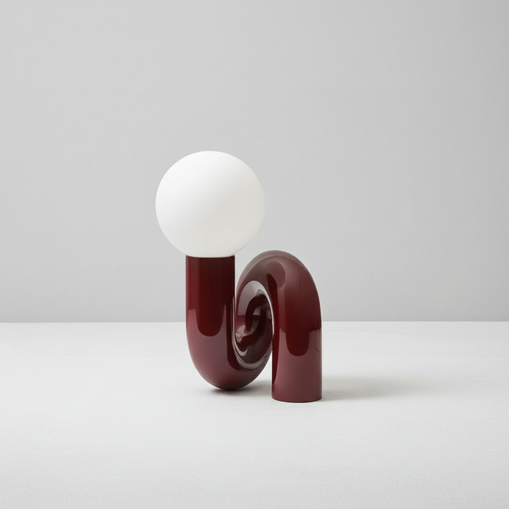 Decorative lamp with a white bulb and brown base on a white background.