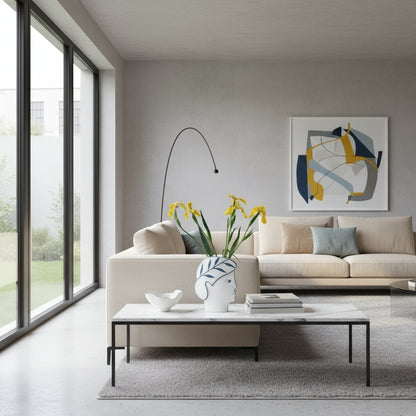 Decorative vase with face design on a table with flowers and candles.