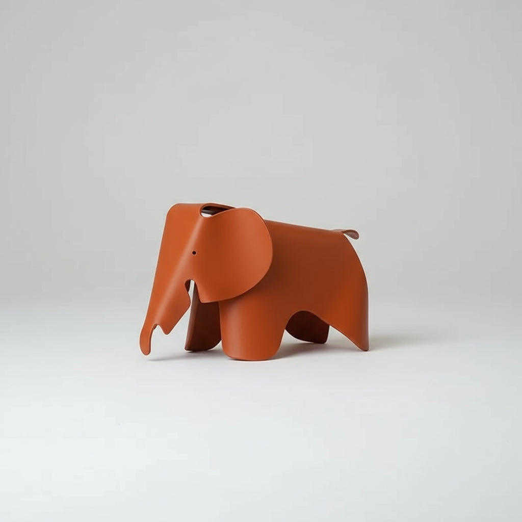 Beige elephant-shaped decor item on a white background
