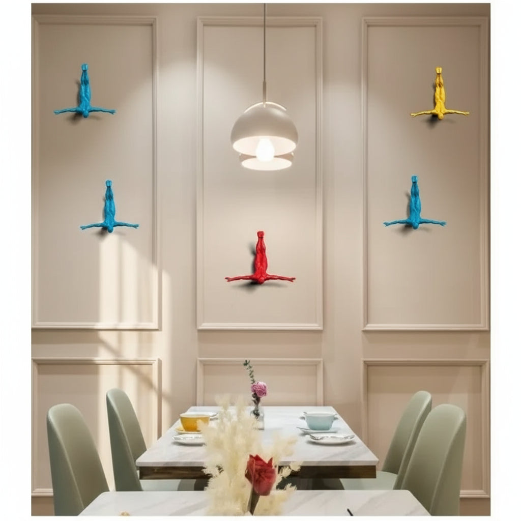 Dining area with colorful wall decorations and a hanging light fixture.