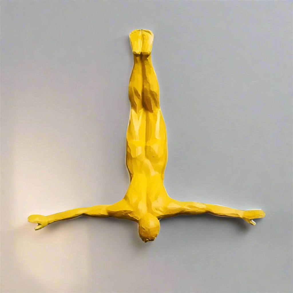 Yellow abstract sculpture on a white background