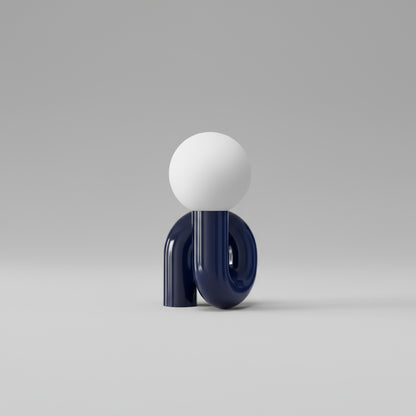 Decorative wall light with a white sphere and blue base, on a white background.