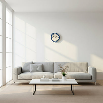 Wall clock with blue frame on a neutral wall