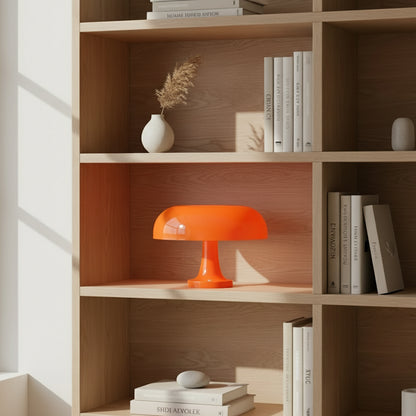 orange modern table lamp on a book shelf