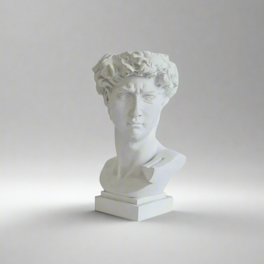 White resin bust vase of a classical David on a gray background