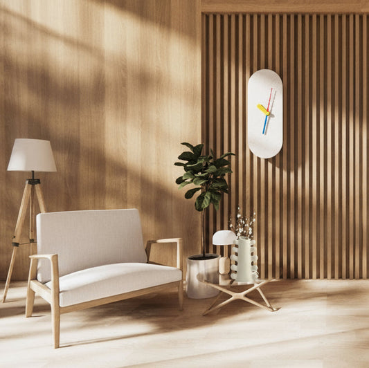 Modern living room with a beige sofa, wooden floor, a scandinavian clock and decorative elements.